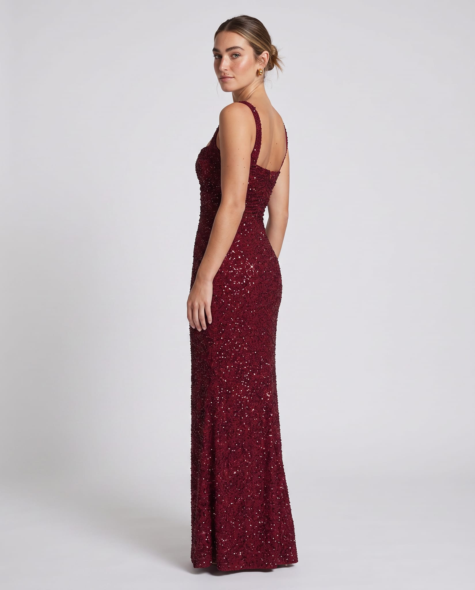 Calanthe Maxi Dress Burgundy Sparkle – model back view over shoulder, light gray studio