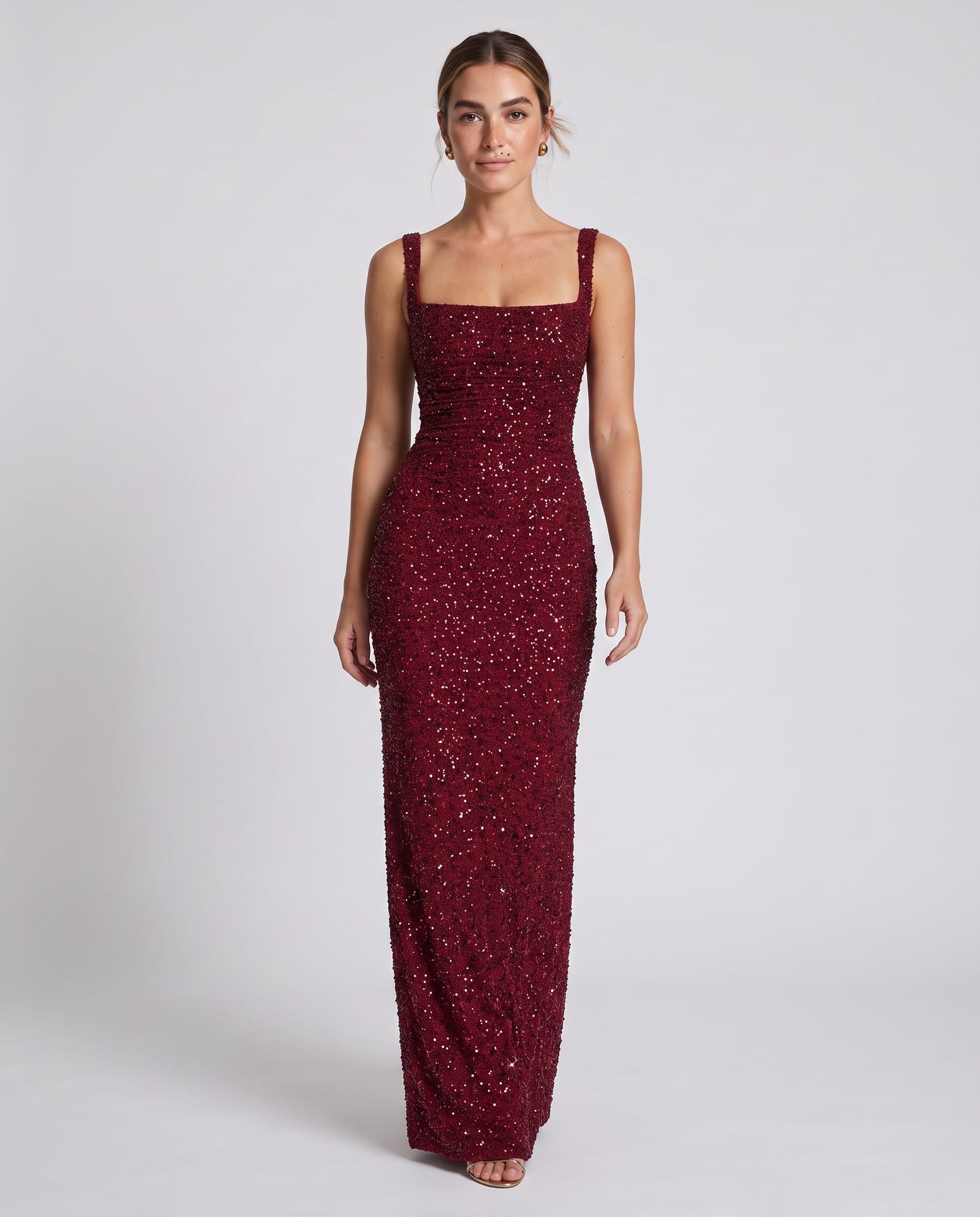 Calanthe Maxi Dress Burgundy Sparkle – model walking pose, light gray studio
