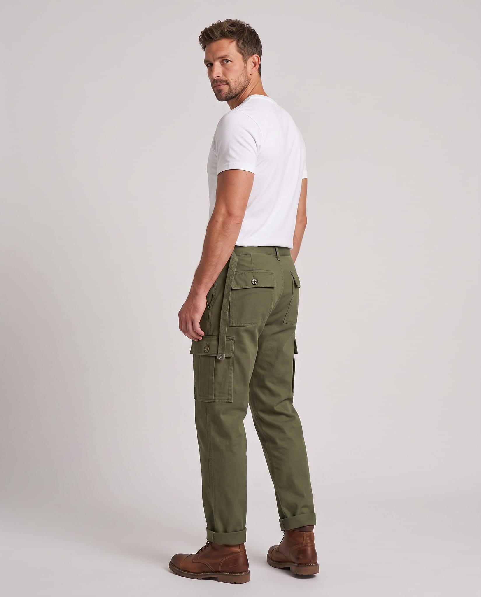 Men's Rugged Cargo Trousers – model back view over shoulder, light gray studio