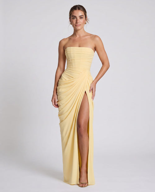Celeste Maxi Dress Lemon – model three-quarter view, light gray studio