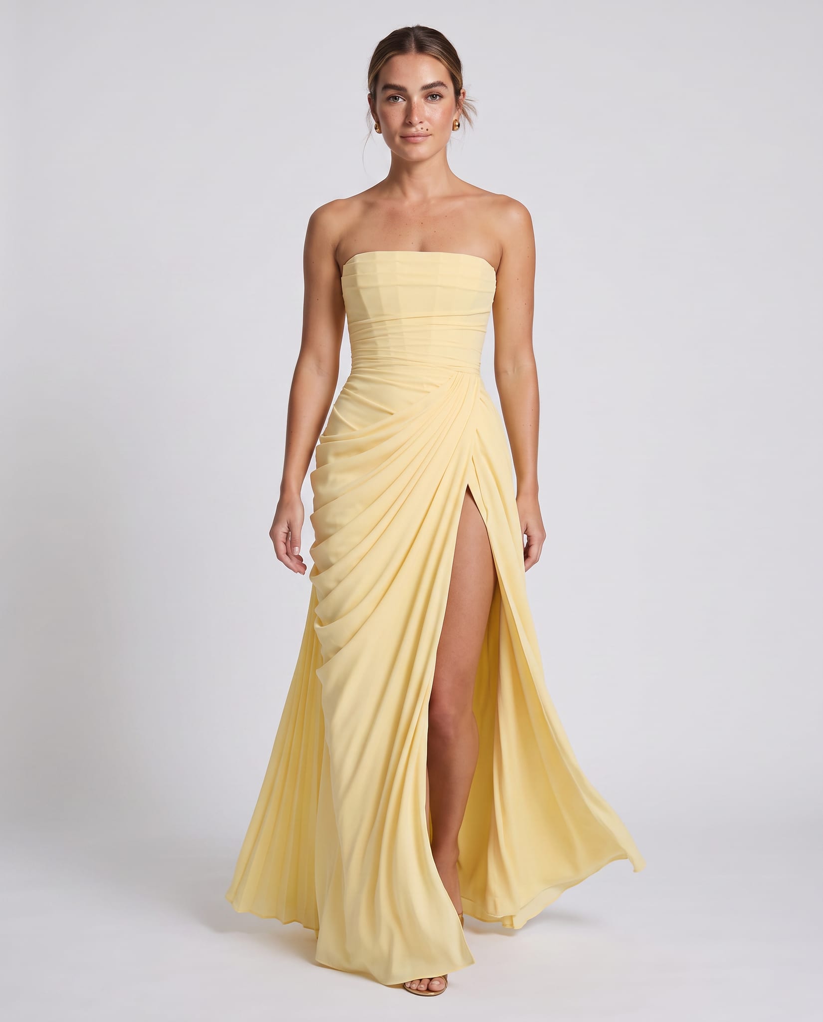 Celeste Maxi Dress Lemon – model walking pose, light gray studio