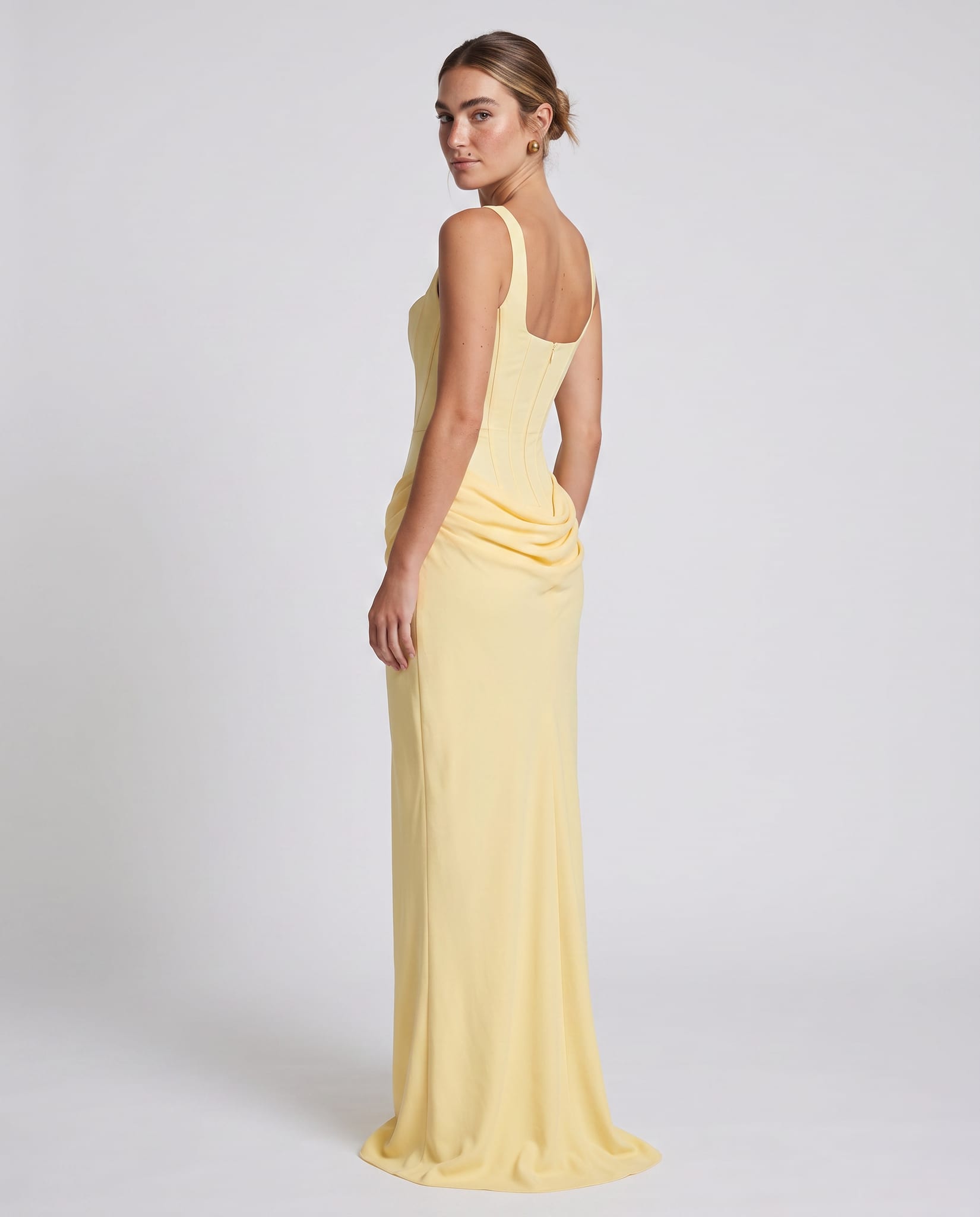 Cornelia Maxi Dress Lemon – model back view over shoulder, light gray studio