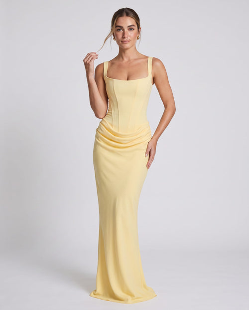 Cornelia Maxi Dress Lemon – model three-quarter view, light gray studio