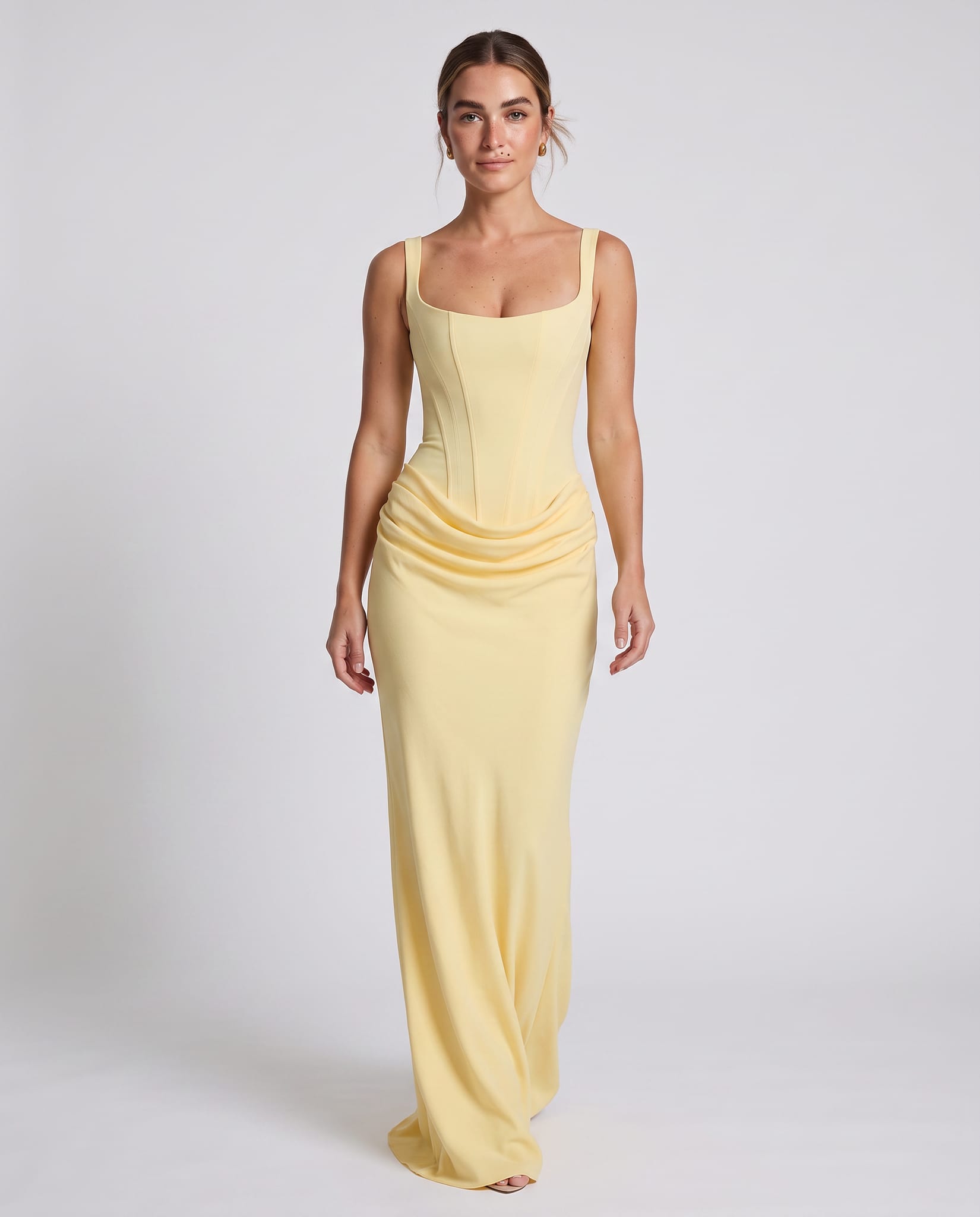 Cornelia Maxi Dress Lemon – model walking pose, light gray studio