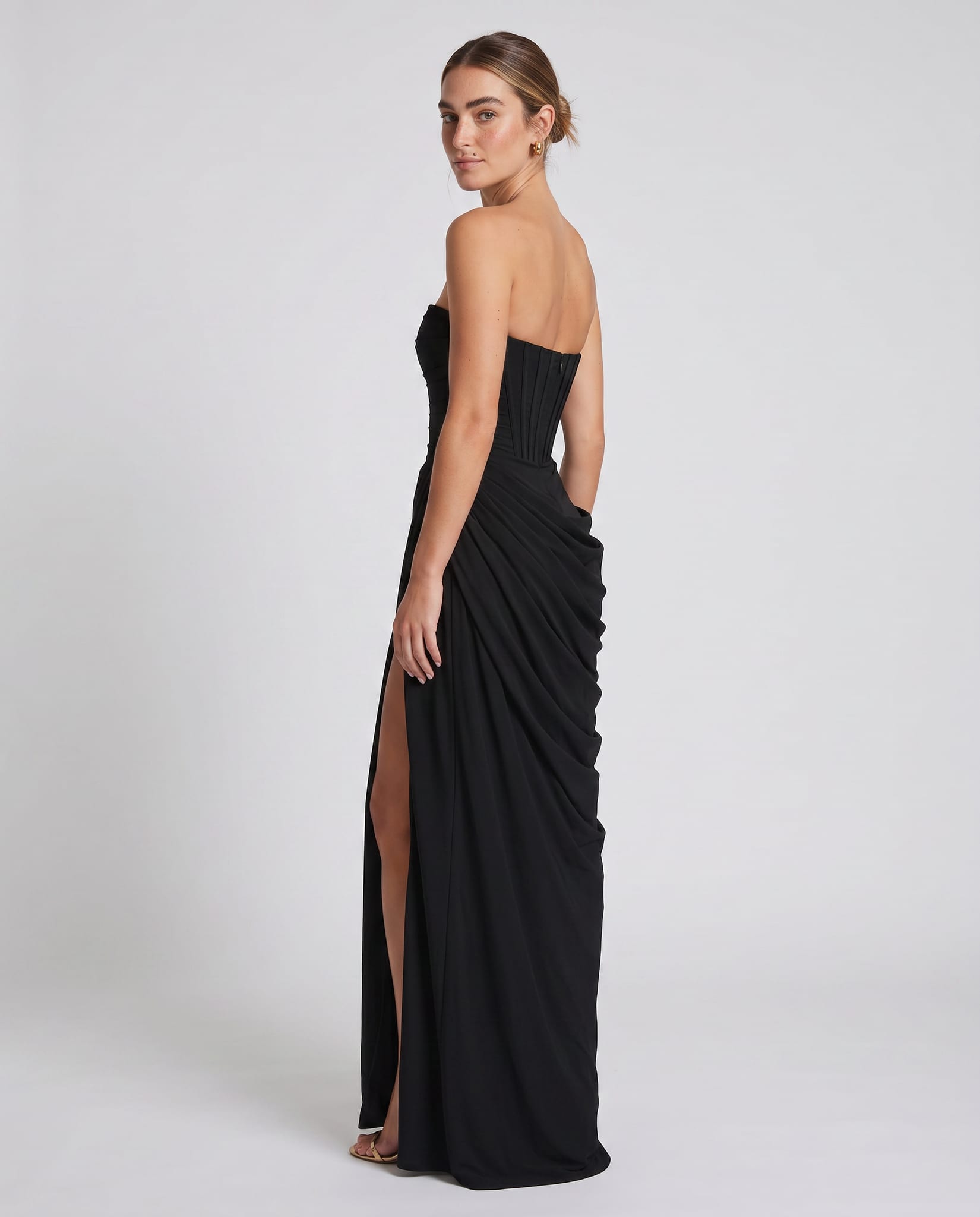 Cyra Maxi Dress Black – model back view over shoulder, light gray studio