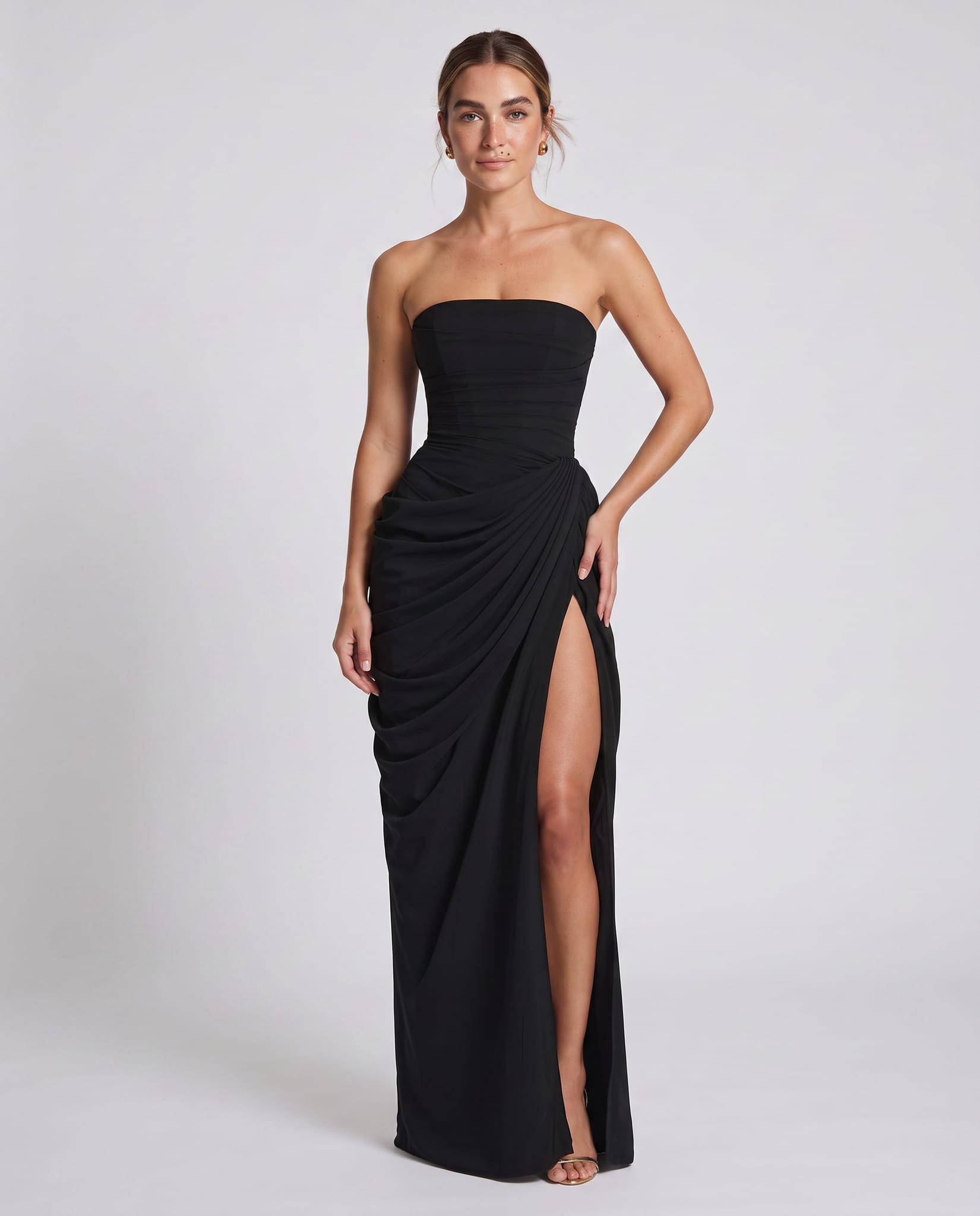 Cyra Maxi Dress Black – model three-quarter view, light gray studio