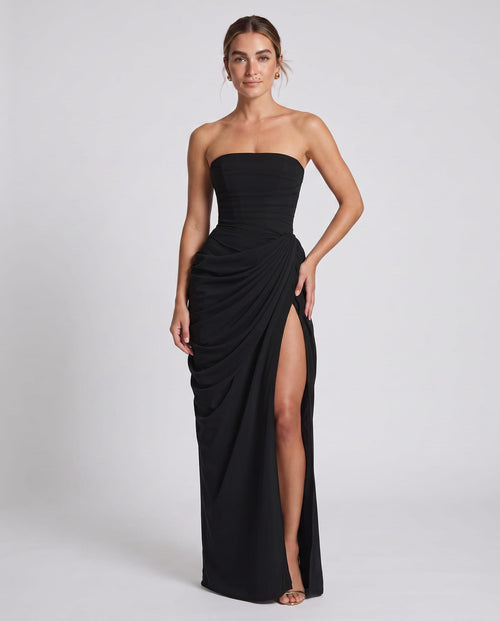 Cyra Maxi Dress Black – model three-quarter view, light gray studio