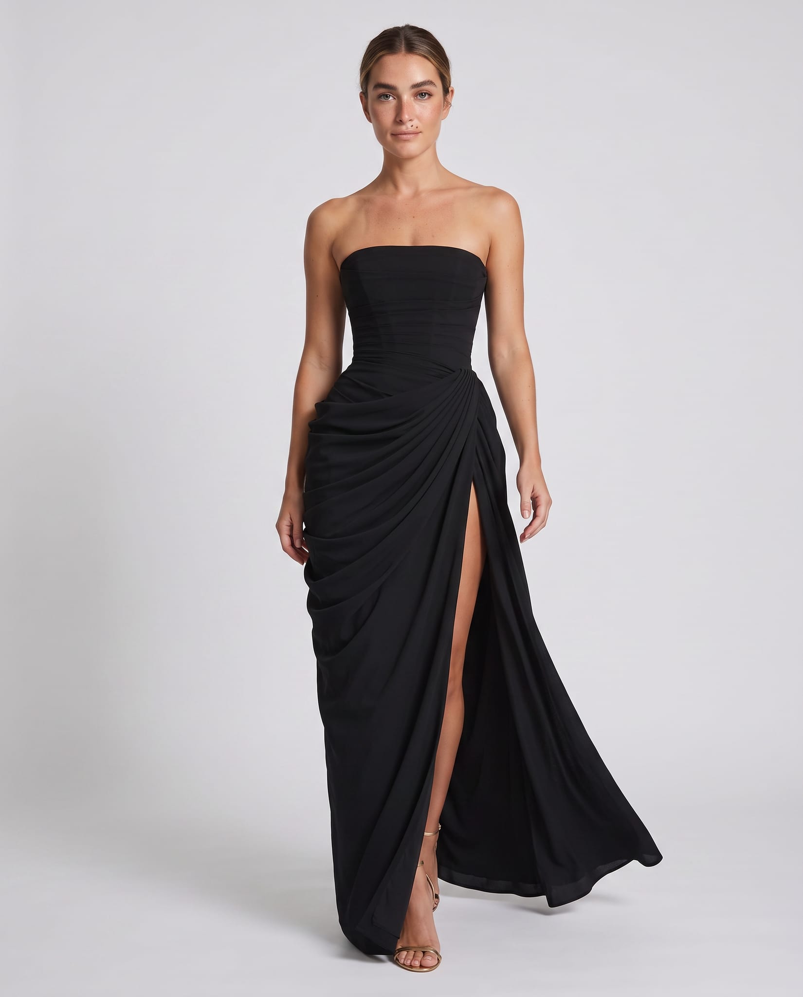 Cyra Maxi Dress Black – model walking pose, light gray studio