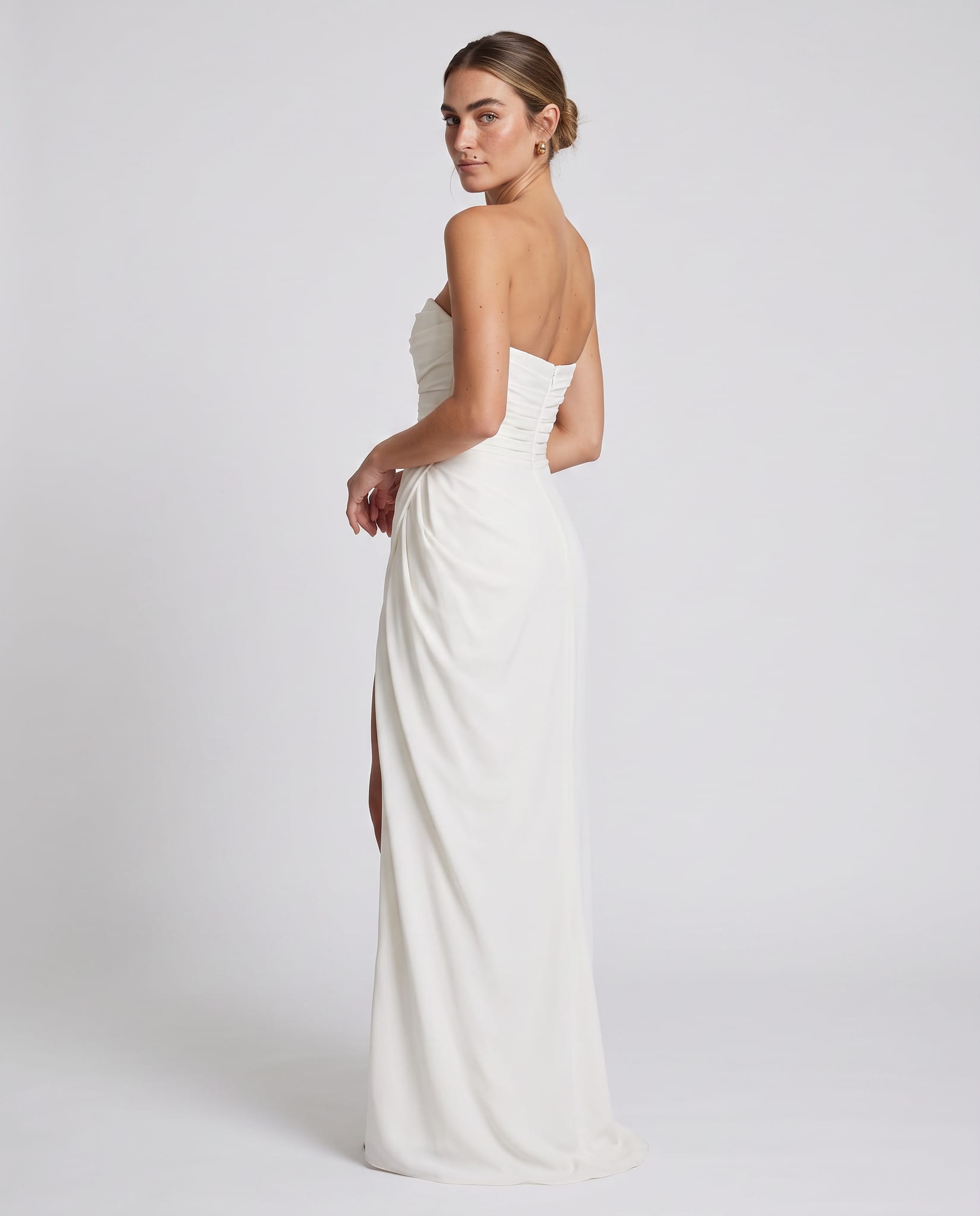 Cyra Maxi Dress Ivory – model back view over shoulder, light gray studio