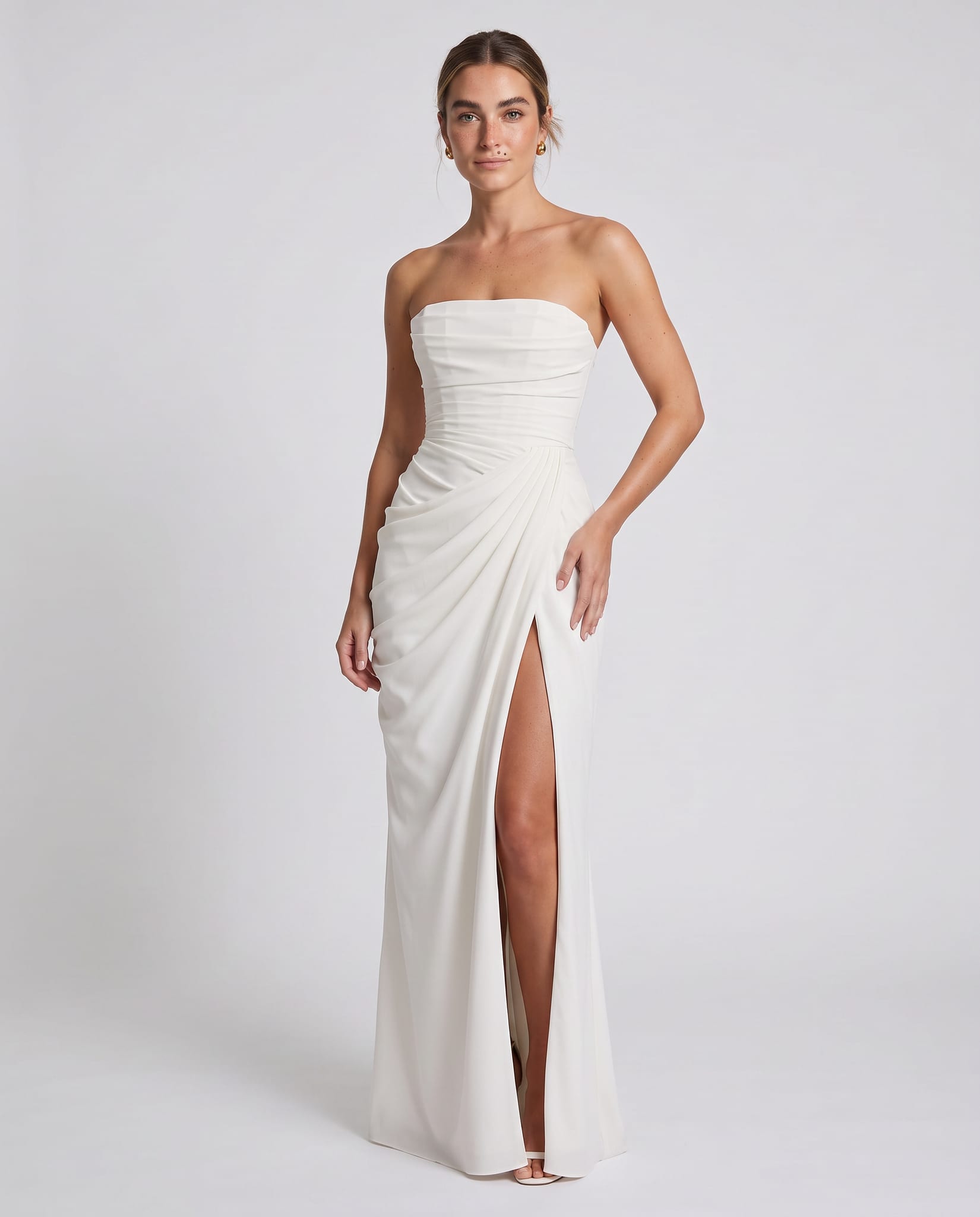 Cyra Maxi Dress Ivory – model three-quarter view, light gray studio