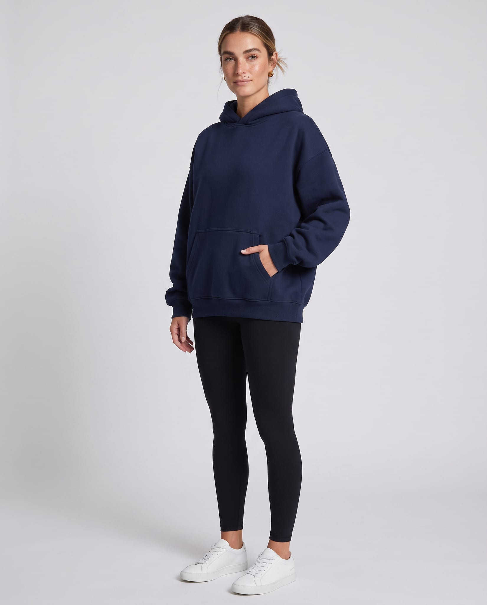 Women's Oversized Everyday Hoodie – model three-quarter view, light gray studio