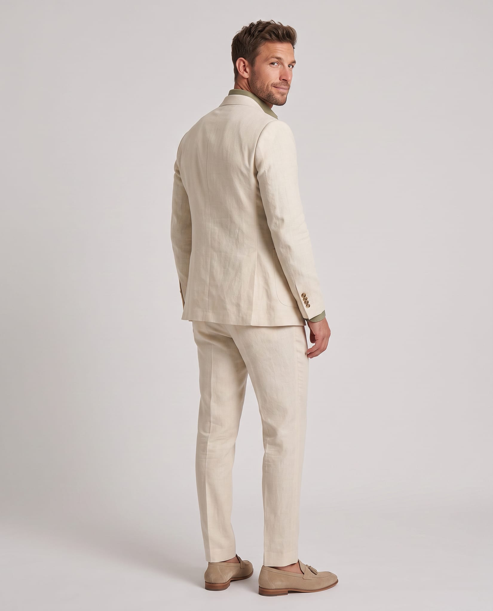 Men's Premium Linen Suit – model back view over shoulder, light gray studio