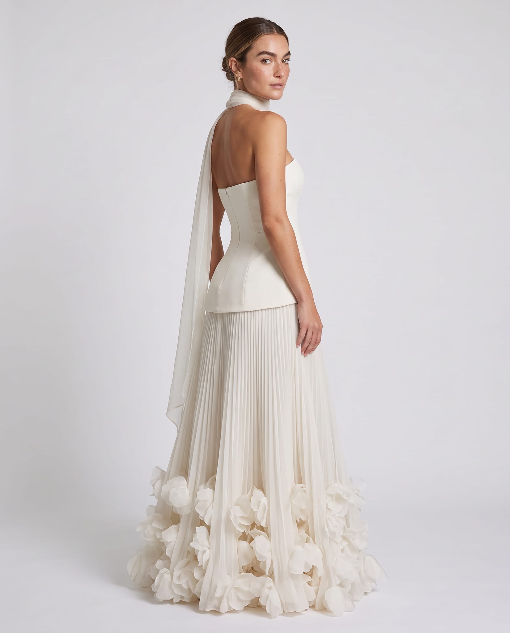 Seraphina Gown Ivory – model back view over shoulder, light gray studio