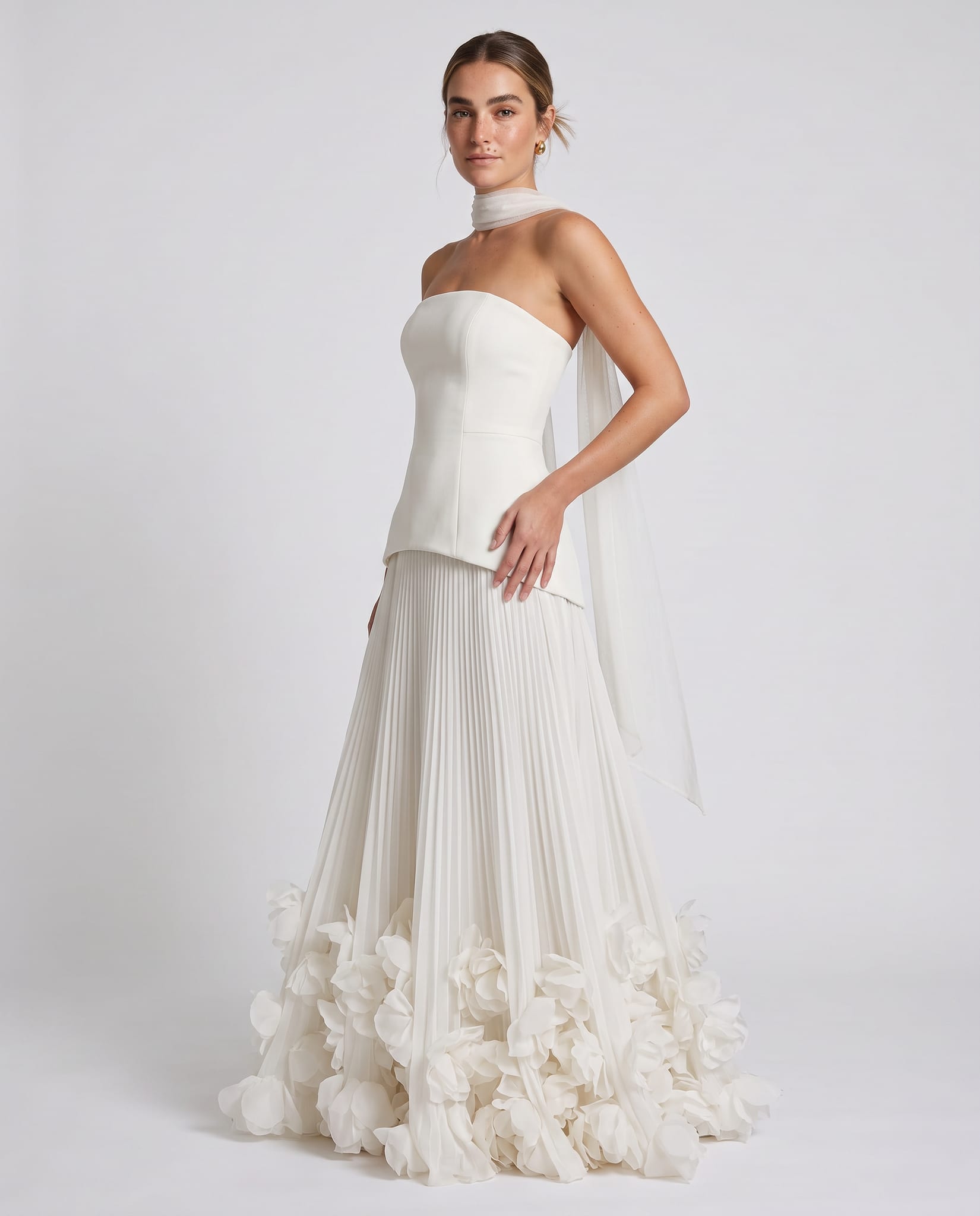 Seraphina Gown Ivory – model three-quarter view, light gray studio