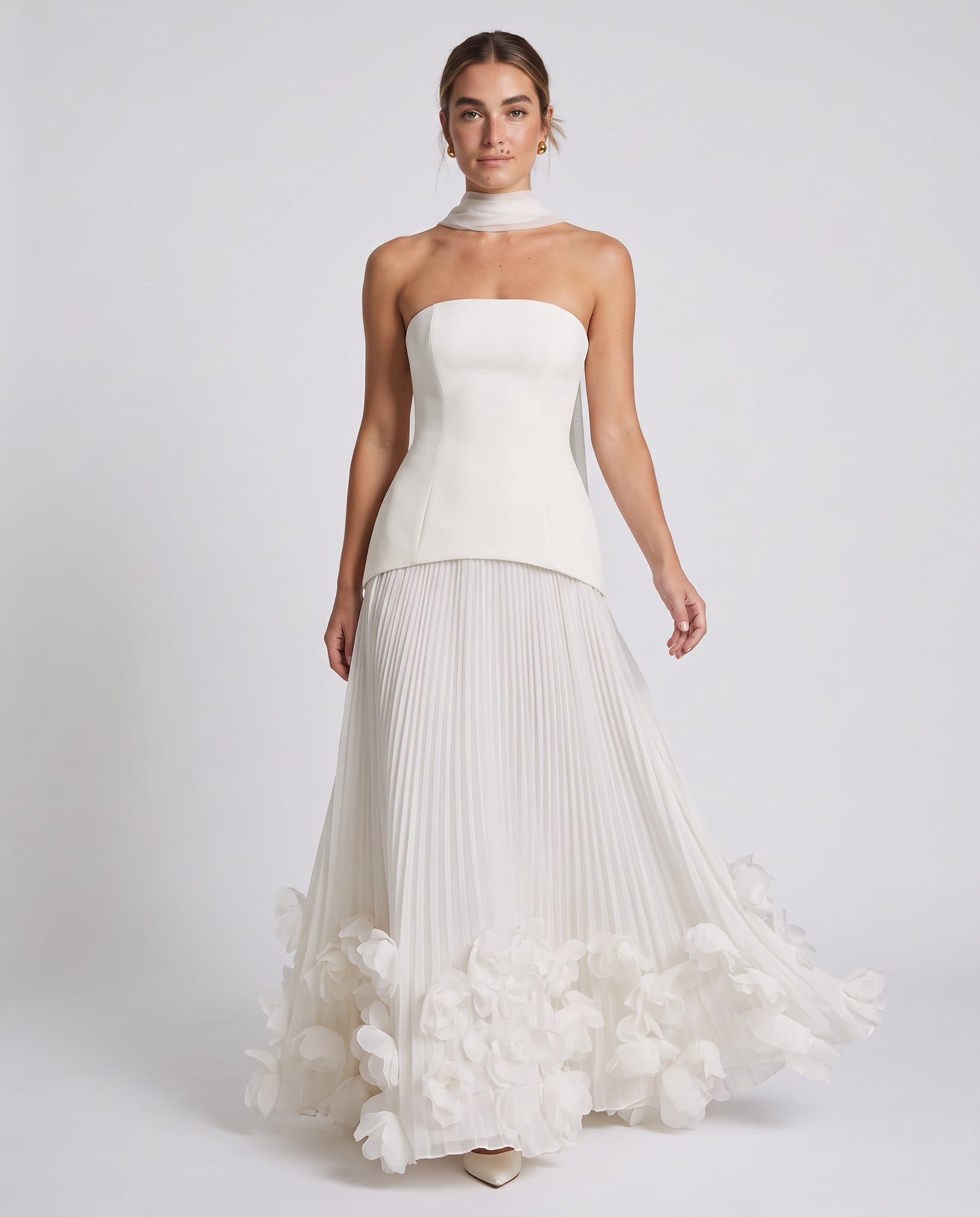 Seraphina Gown Ivory – model walking pose, light gray studio