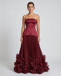 Seraphina Gown Cherry Lacquer – model front view, light gray studio