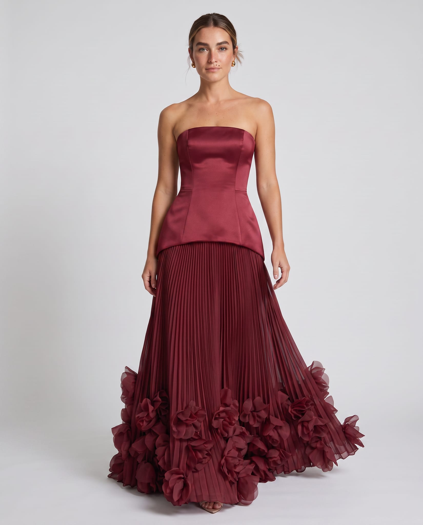 Seraphina Gown Cherry Lacquer – model walking pose, light gray studio