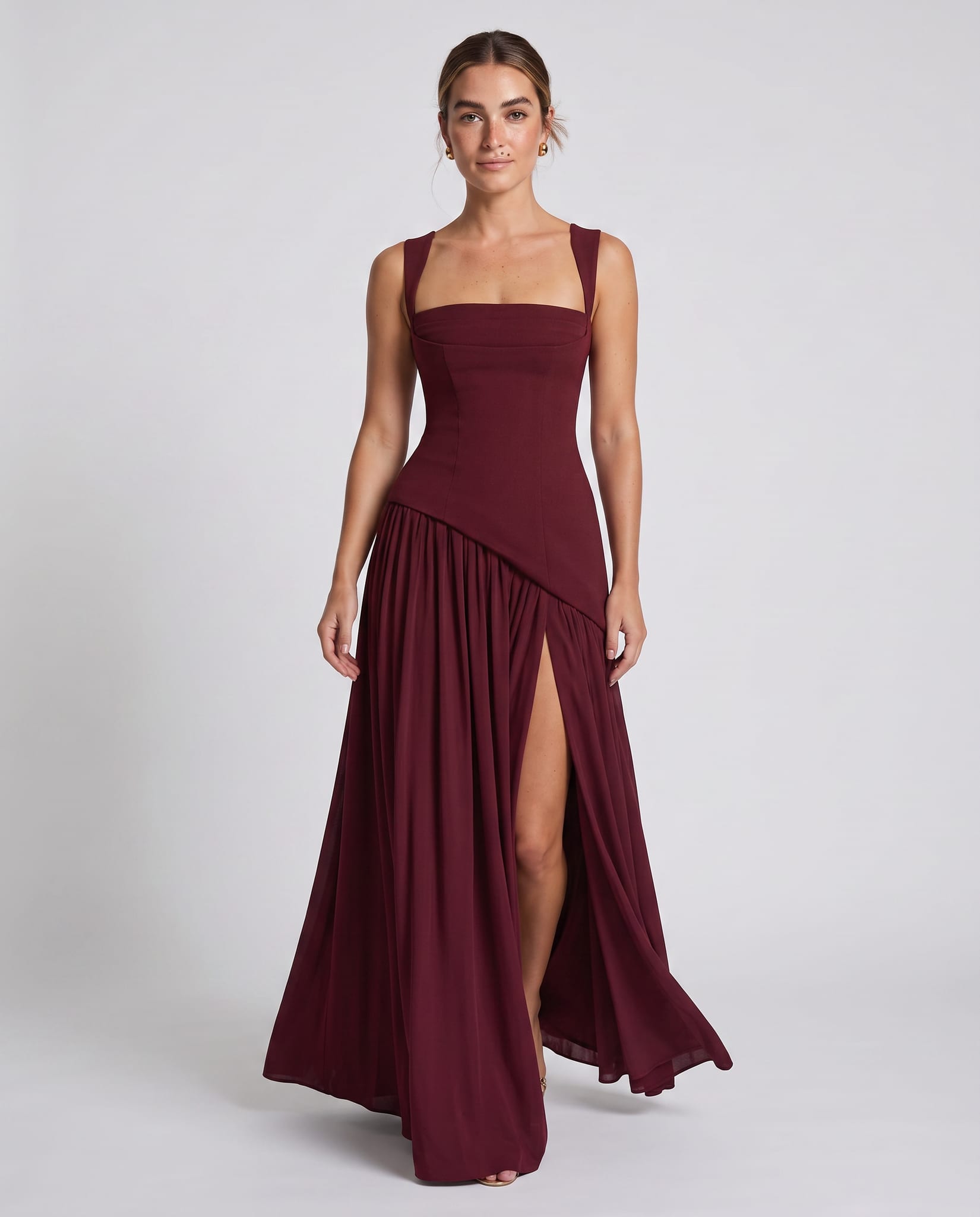 Seraphine Maxi Dress Cherry Lacquer – model walking pose, light gray studio